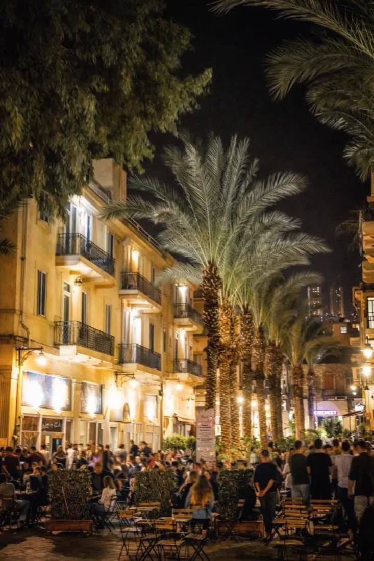 The palms are still there. So are the tables, and they fill up after dark.